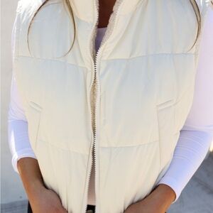 Cropped cream puffer vest.  Fleece lined.